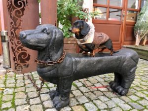 dog on a dog statue in Europe